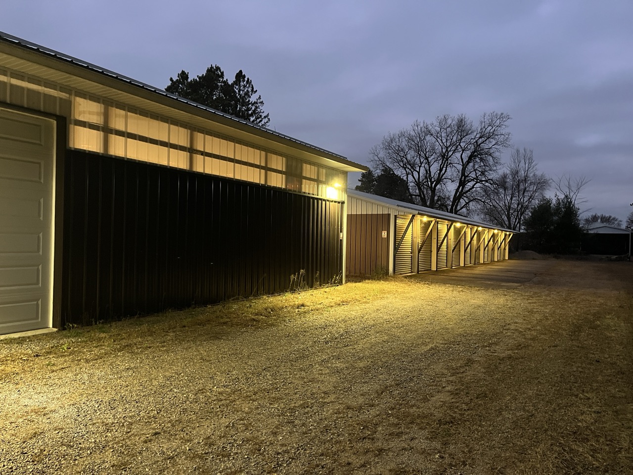 Storage units lit by exterior lighting at dusk